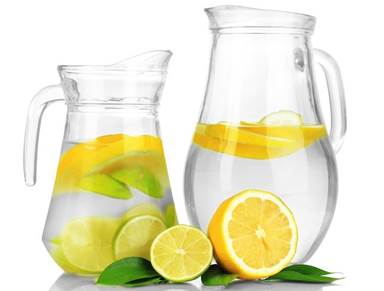 fresh water pitcher with lemon and lime slices
